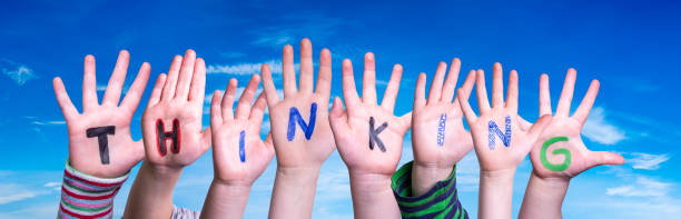 istock Children Hands Building Word Thinking, Blue Sky 1224110886