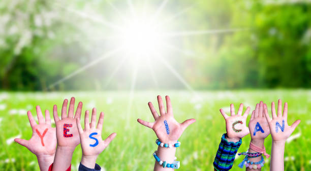 istock Children Hands Building Word Yes I Can, Grass Meadow 1224111581