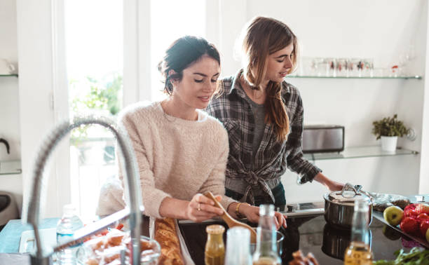 istock happiness friends cooking together at home 1224111665