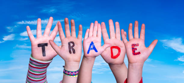 istock Children Hands Building Word Trade, Blue Sky 1224111831