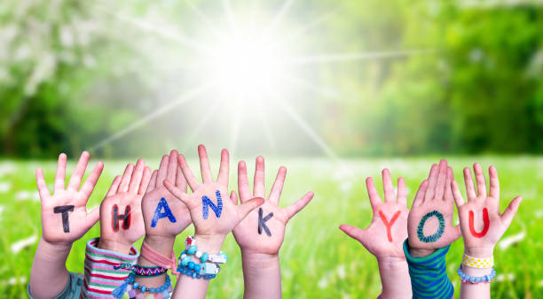 istock Children Hands Building Word Thank You, Grass Meadow 1224112021