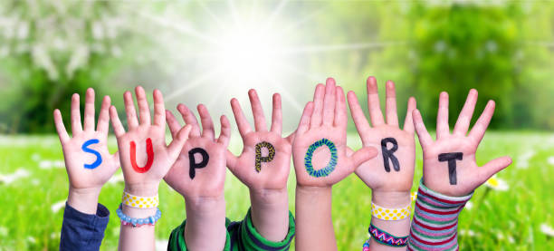 istock Children Hands Building Word Support, Grass Meadow 1224112194