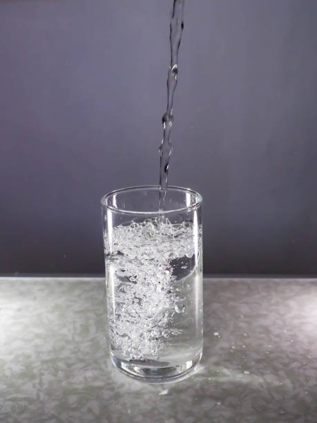 istock Water is poured into a glass 1224113458