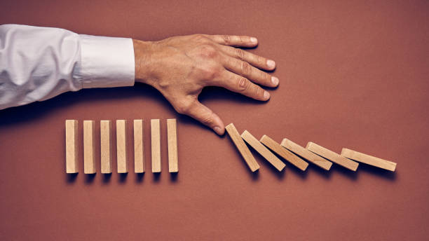 istock Men's hand and wooden blocks arranged in a conceptual image 1224113977
