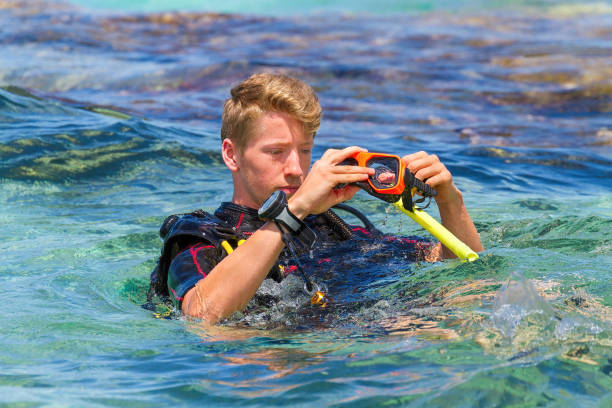 istock Young dutch diver in sea holding diving mask 1224115019