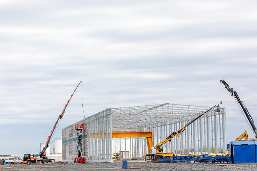 A new industrial building is installation with steel structure.