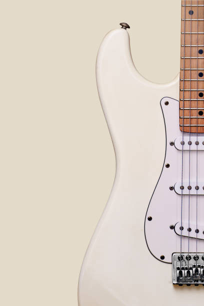 istock Close-up of a guitar on a yellow background 1224121453