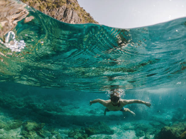 istock Man free diving  near Koh Phi Phi Island 1224125147