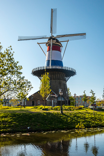 Windmill of Leiden wrapped in Netherlands three coloured flag, Holland Netherlands