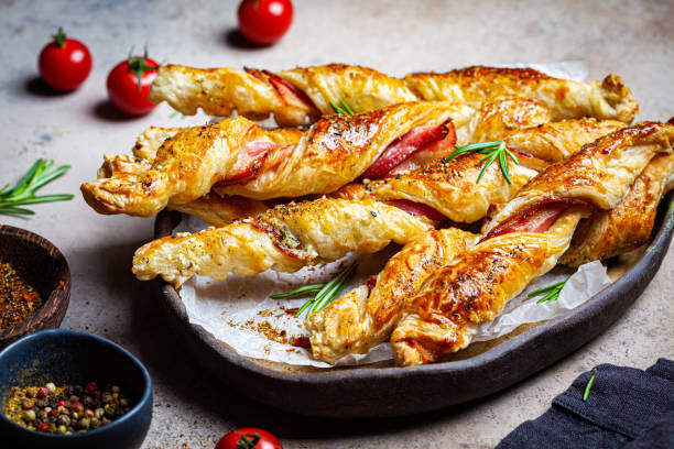 istock Crispy bread sticks with cheese, bacon and spices. 1224127450