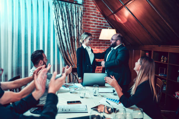 istock Female Accountant Getting Promotion By CEO During Meeting 1224128454