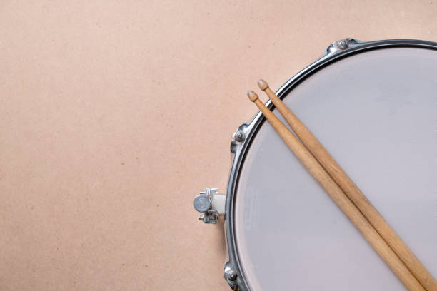 istock Drum stick and drum on the table background, top view, music concept 1224129103