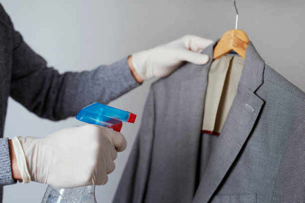 istock man disinfecting a sport jacket 1224129389