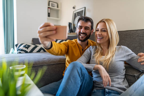 istock Young couple relaxing at home 1224133157