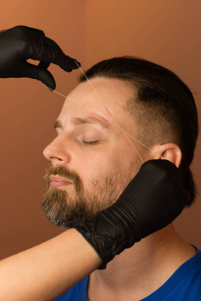 Correcting shape of eyebrows to male clien
