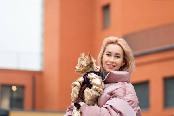 istock Girl walks with a dog 1224135758