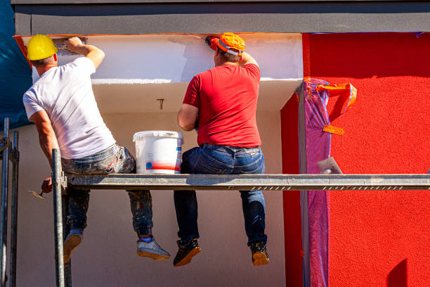 istock Construction workers plaster the facade of the building. 1224135958