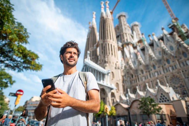 istock Male Tourist Using Smart Phone for Directions in Barcelona 1224135963