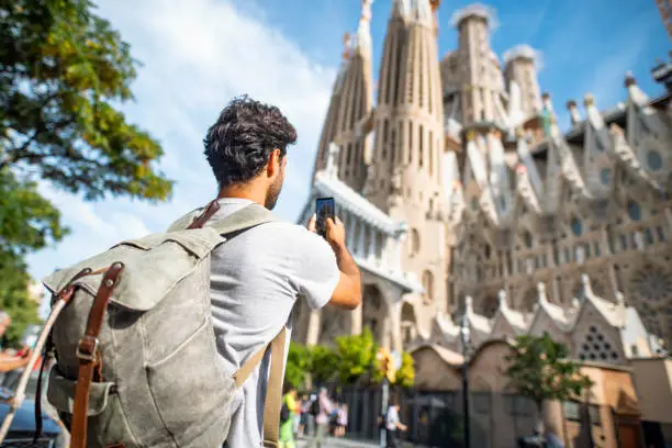 Photo of Backpacker Photographing Sagrada Familia with Smart Phone