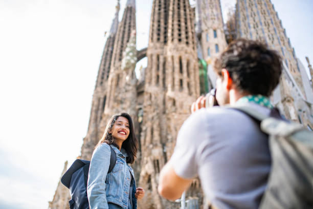 istock Smiling Indian Vacationer Posing for Picture in Barcelona 1224136046
