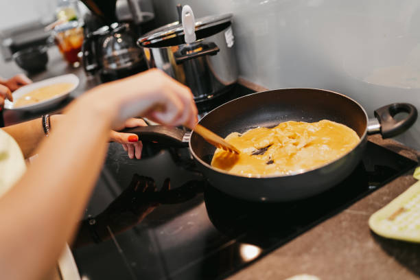istock Young woman preparing breakfast 1224136943