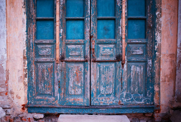 istock Blue closed vintage wooden doors background 1224137555