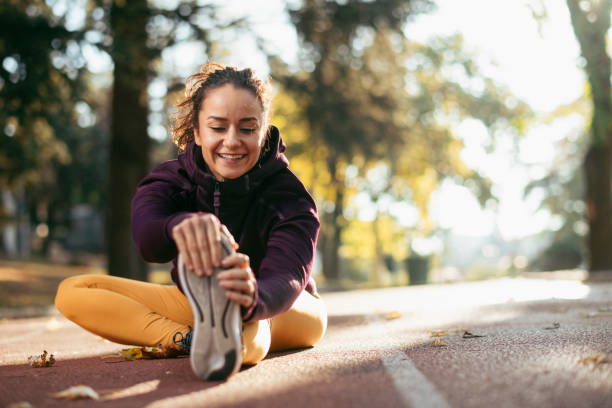 istock Young athletic woman stretching herself in park. 1224137682