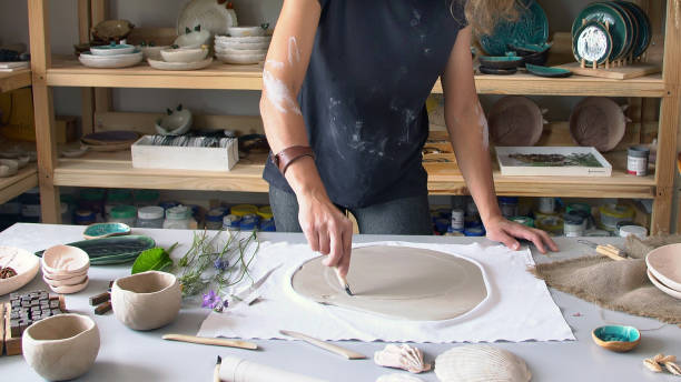 istock the sculptor works in his workshop, and creates ceramic products 1224137858