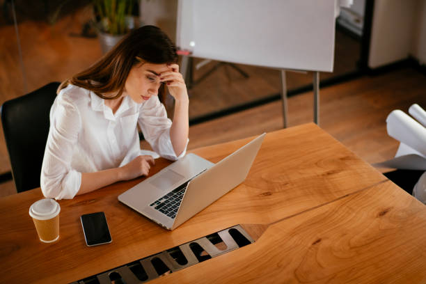 istock Tired businesswoman working in office. 1224137965