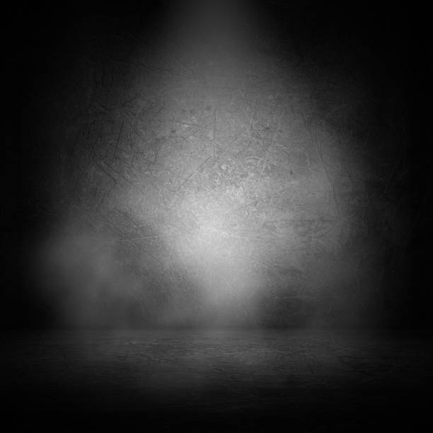 istock 3D grunge interior with smoke in spotlight 1224139201