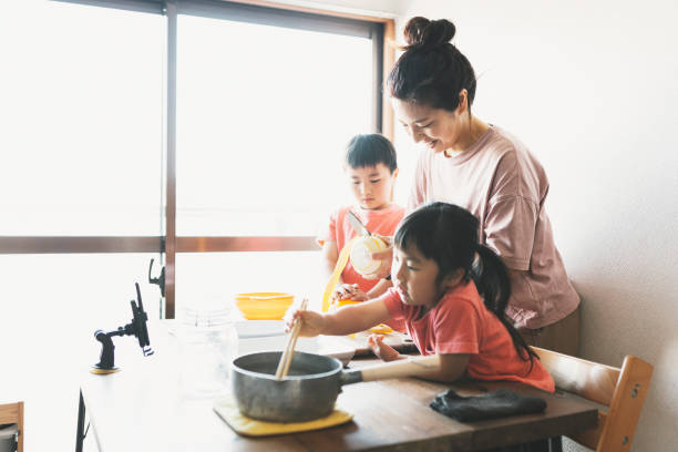 istock Family cooking for video streaming 1224140552