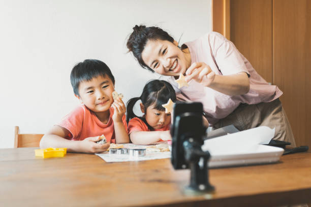 istock Family cooking for video streaming 1224140596