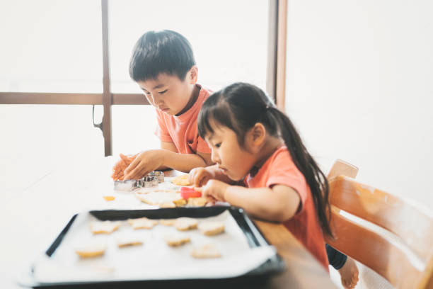istock Siblings cooking at home 1224140622