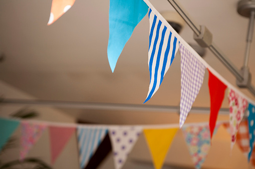 Patterned bunting flags hanging indoors