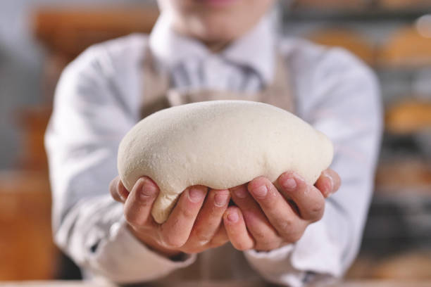 istock An experienced chef in a professional kitchen prepares the bread with her daughter with flour to make the bio Italian pasta. 1224144486