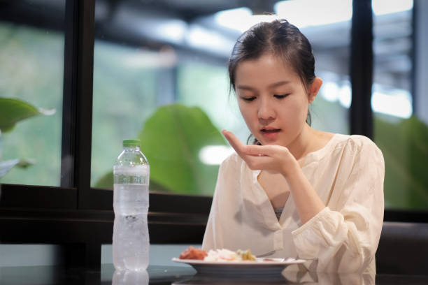 istock A woman take a pill after meal 1224145337