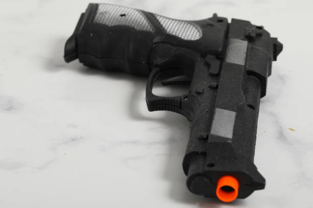 istock Plastic toy gun, Toy isolated. Kid weapon 1224146445