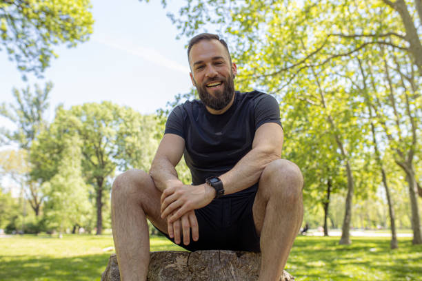 istock Man with beard relaxing in the park after workout 1224147951