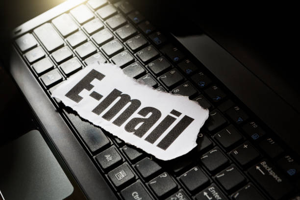 istock Paper cutting saying E-mail on a laptop keyboard in moody lighting 1224148938