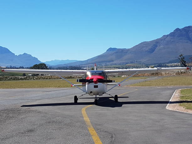 istock Airplane with mountains in backround 1224150945