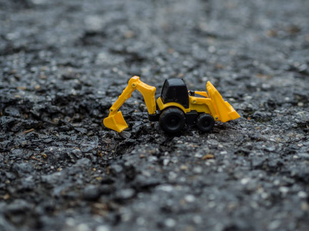 istock Toy construction machinery working on an excavation 1224151182