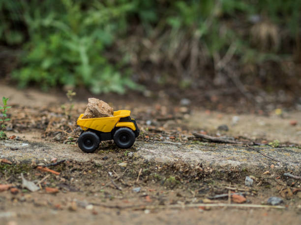 istock Toy construction machinery working on an excavation 1224151757