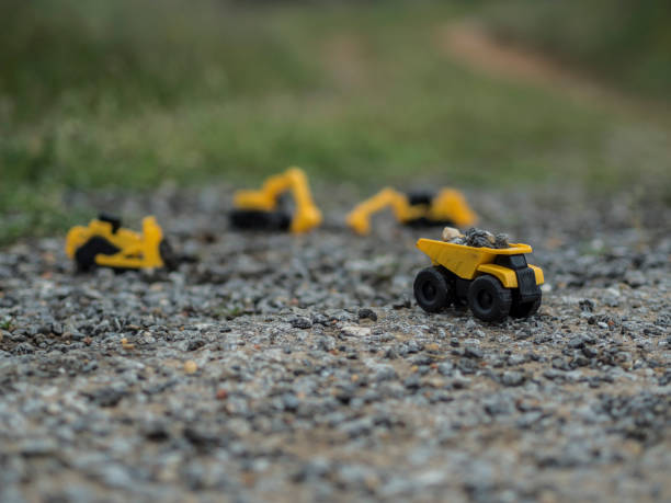 istock Toy construction machinery working on an excavation 1224151846