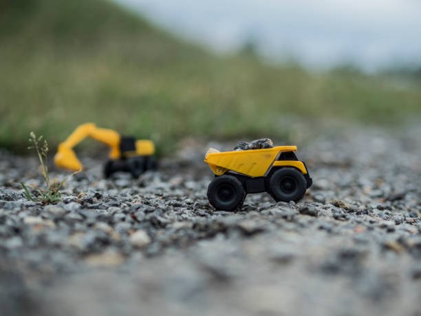 istock Toy construction machinery working on an excavation 1224151979