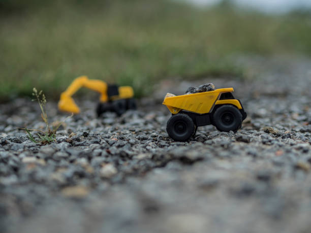 istock Toy construction machinery working on an excavation 1224152068