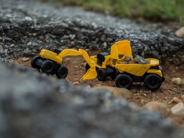 istock Toy construction machinery working on an excavation 1224152174