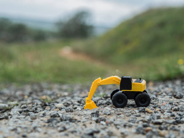 istock Toy construction machinery working on an excavation 1224152175