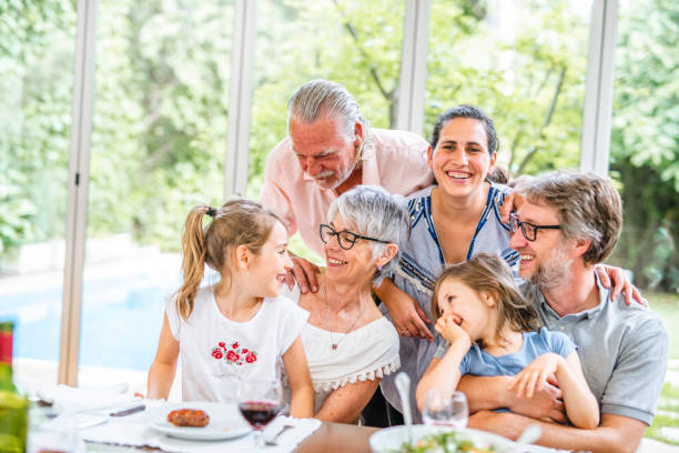 istock Family Affection at Dining Table Before Midday Meal 1224152906