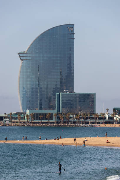 Barcelona, Spain. 8th May, 2020. People on the Barceloneta beach. From friday, Barcelona reopened its beaches in the mornings for individual sports activities only, such as swimming or surfing. Access to beach is controlled by police