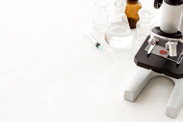 istock Microscope medical reserch. Blood sample for analysis. White table copy space 1224154587